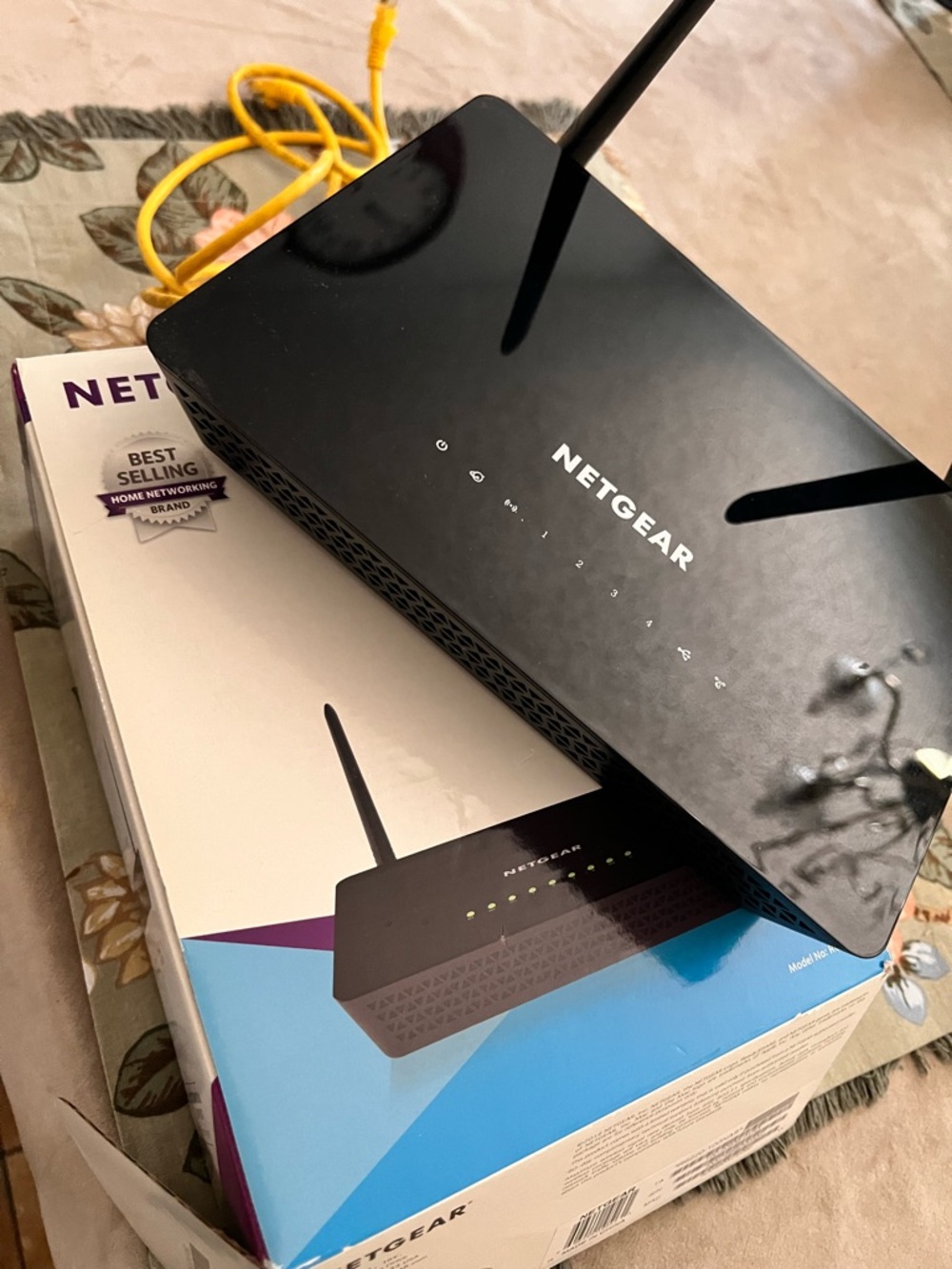 NETGEAR Black Wireless Router with Yellow Ethernet Cable